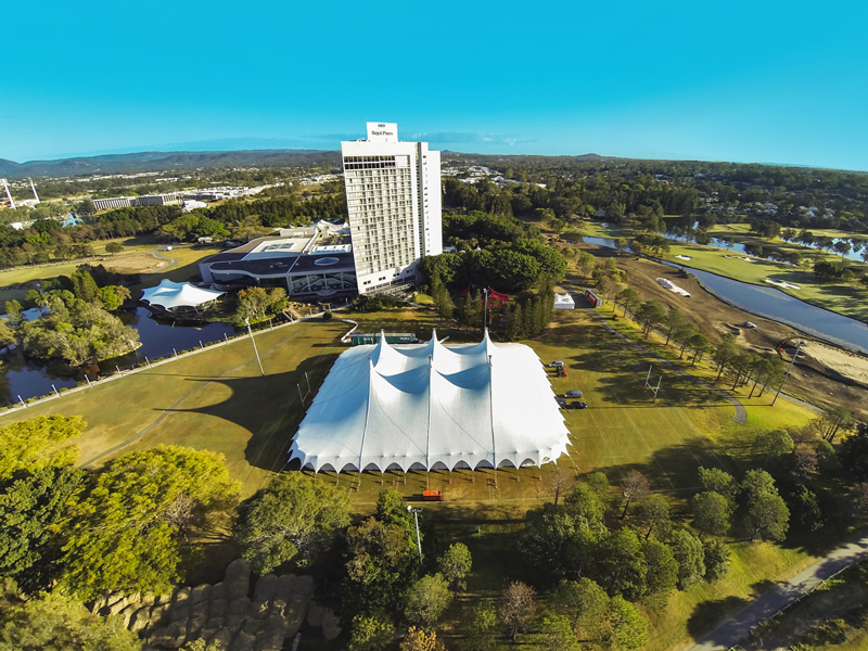Aerial view of a 50 by 65 metre main tent beside a resort