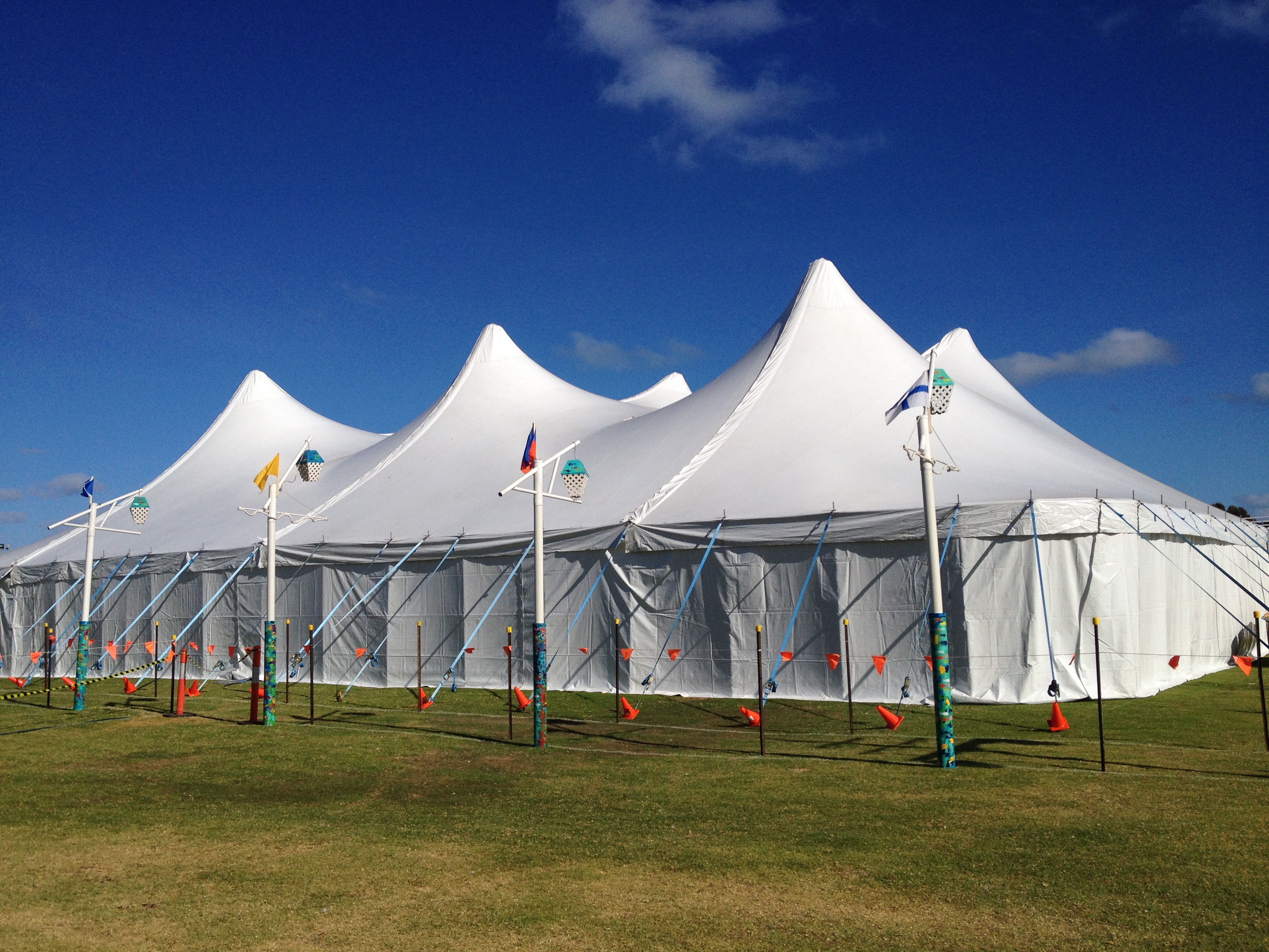 A 26 by 36 metre structure with flags and bunting on a school oval